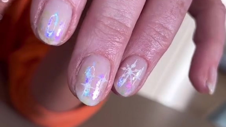 Subtle iridescent snowflake nails